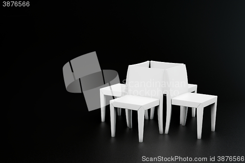 Image of four white plastic chair