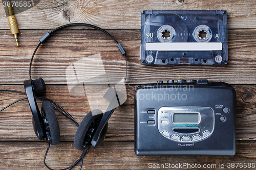 Image of Music concept. Top view of cassette tape, audio player and headphones.