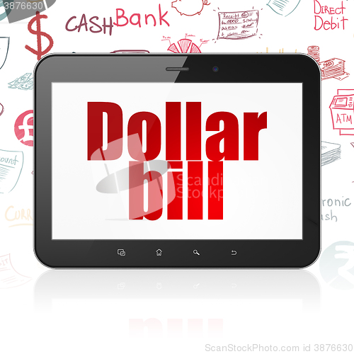Image of Banking concept: Tablet Computer with Dollar Bill on display