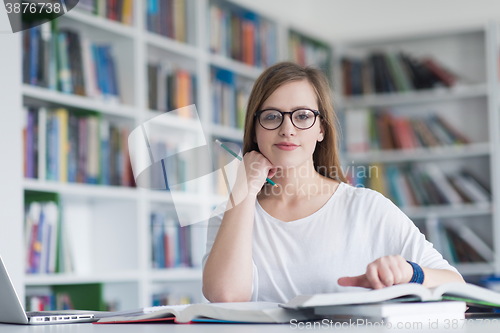 Image of female student study in school library