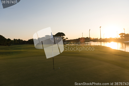 Image of golf ball on edge of  the hole