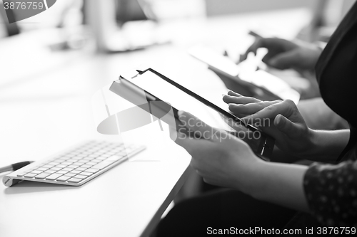 Image of business people on meeting  using tablet computer