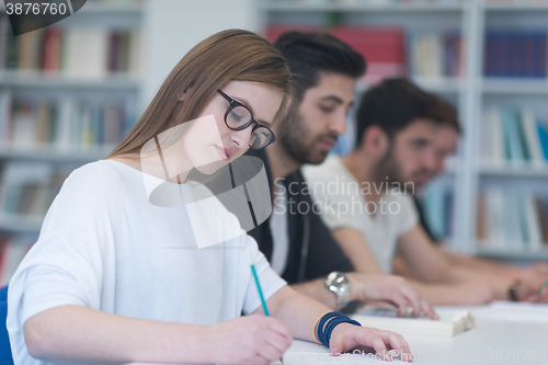 Image of group of students study together in classroom