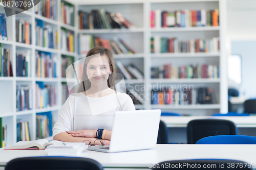 Image of female student study in school library