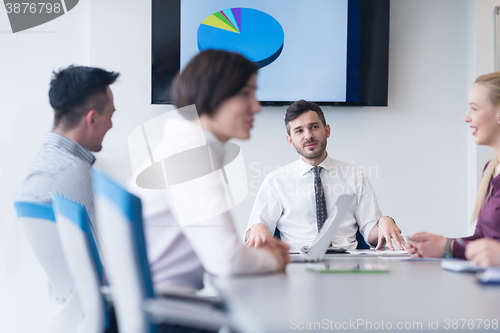 Image of young business people group on team meeting at modern office