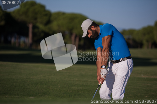 Image of pro golfer hitting a sand bunker shot