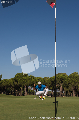 Image of golf player aiming perfect  shot