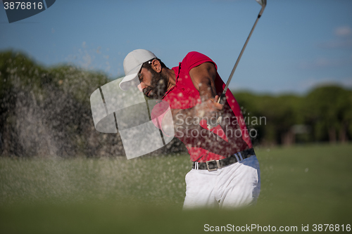 Image of golfer hitting a sand bunker shot