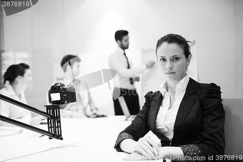 Image of young business woman on meeting  using laptop computer