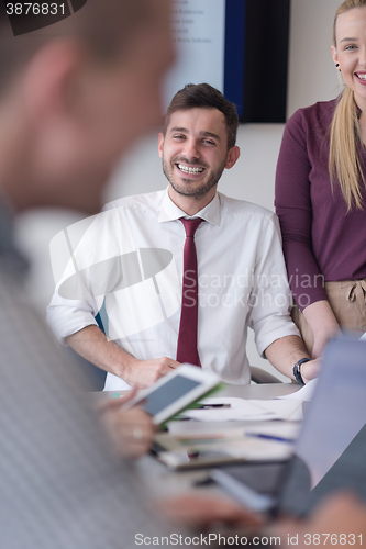 Image of young business people group on meeting at modern office