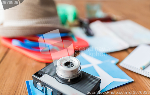 Image of close up of camera, tickets and travel stuff