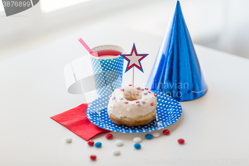 Image of donut with juice and candies on independence day