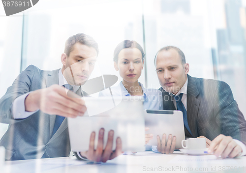 Image of business team with tablet pc having discussion