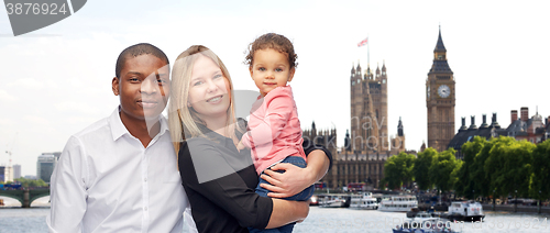 Image of multiracial family with little child in london