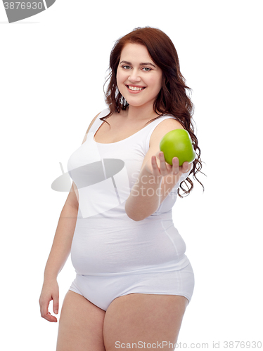 Image of happy plus size woman in underwear with apple