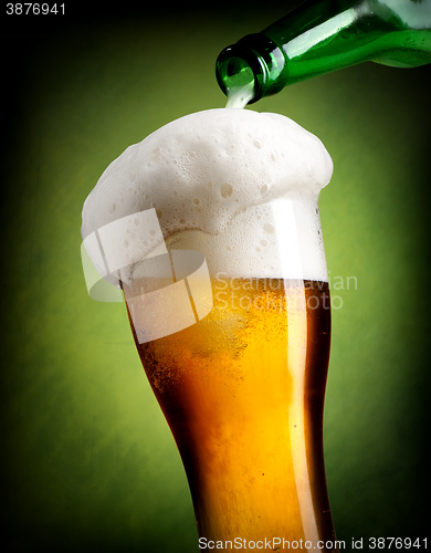 Image of Pouring beer on green