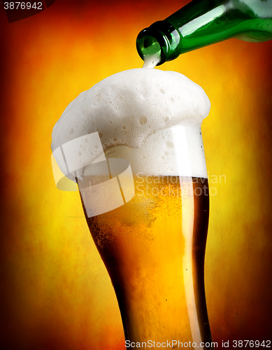 Image of Beer pouring in tumbler