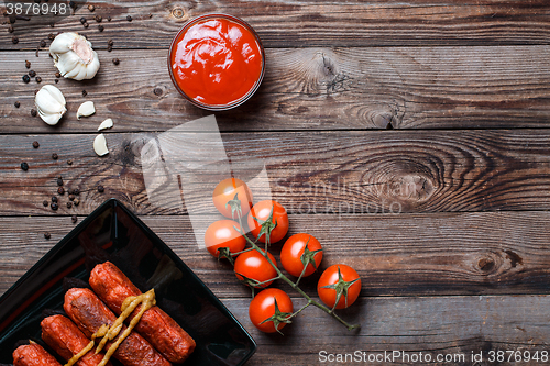 Image of Sausage roasted on the grill.