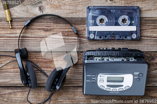 Image of Music concept. Top view of cassette tape, audio player and headphones.