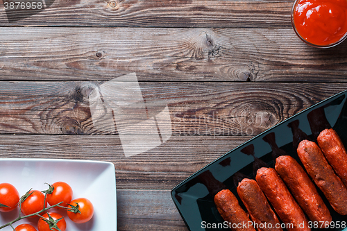 Image of Sausage roasted on the grill.