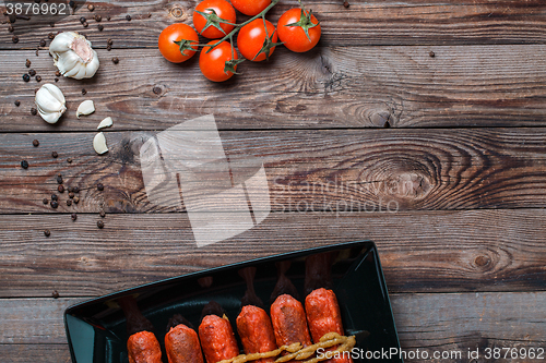 Image of Sausage roasted on the grill.