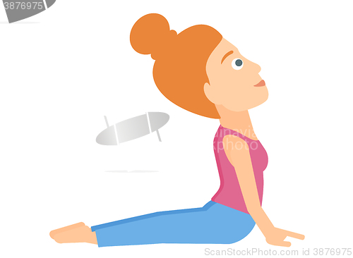 Image of Woman practicing yoga.