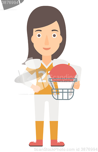 Image of Rugby player with ball and helmet in hands.