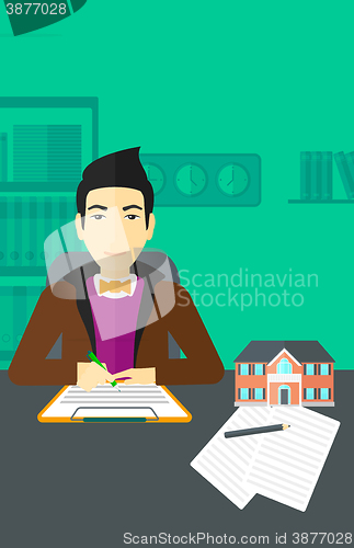 Image of Real estate agent signing contract.