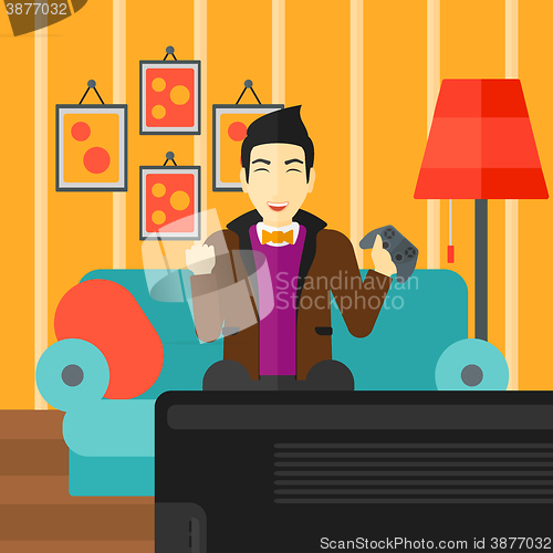 Image of Man playing video game.
