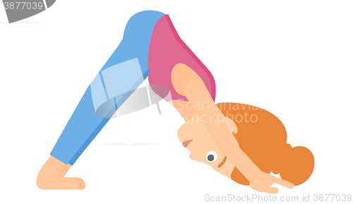 Image of Woman practicing yoga.