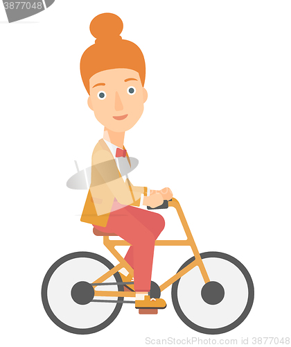 Image of Woman cycling to work.