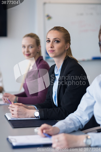 Image of young business people group on team meeting at modern office