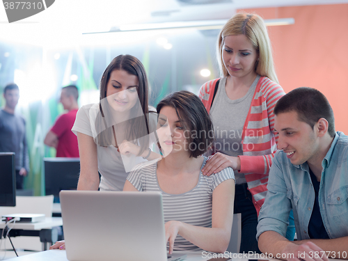 Image of group of students study together in classroom