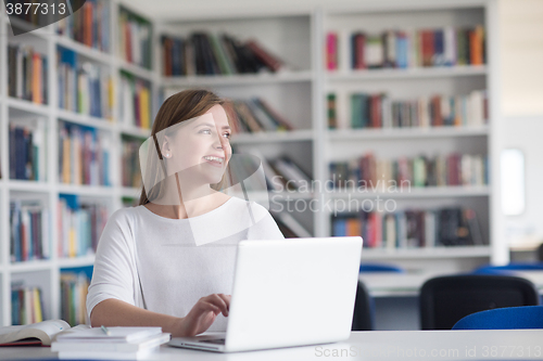 Image of female student study in school library