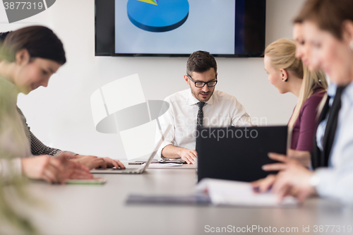 Image of young business people group on team meeting at modern office