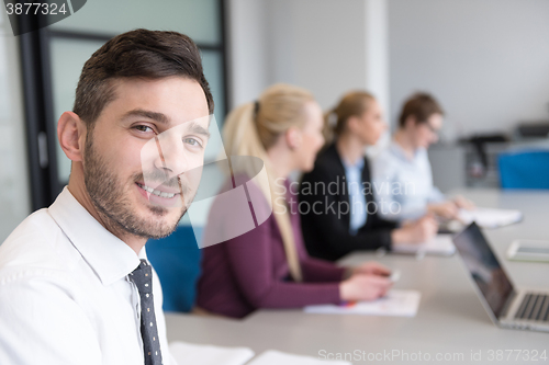 Image of young business people group on team meeting at modern office