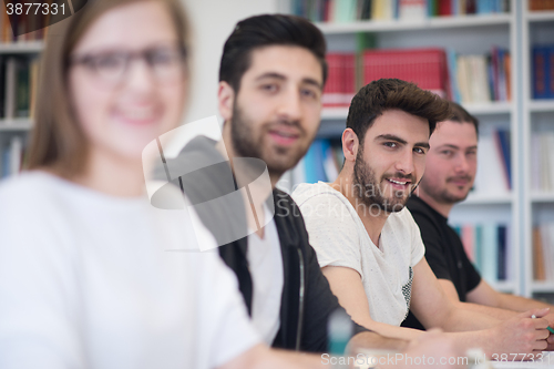 Image of group of students study together in classroom