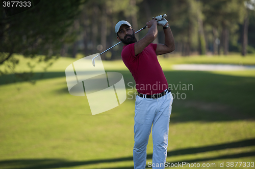 Image of golf player hitting long shot