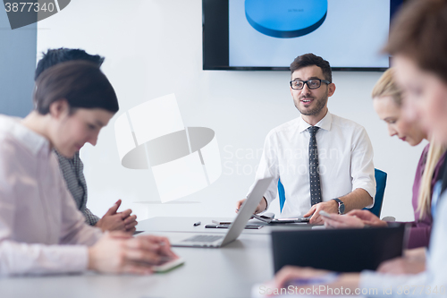 Image of young business people group on team meeting at modern office