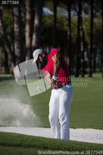 Image of golfer hitting a sand bunker shot