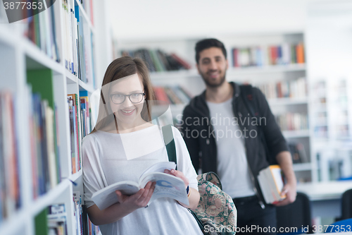 Image of students couple  in school  library