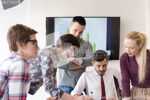 Image of young business people group on meeting at modern office