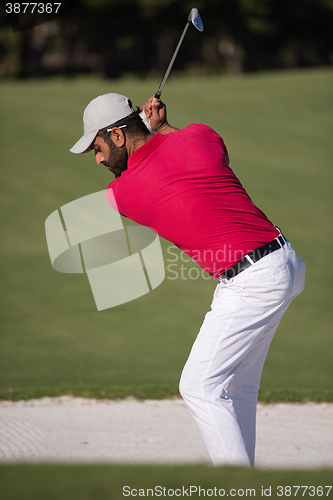 Image of golfer hitting a sand bunker shot