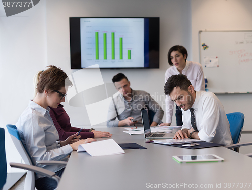 Image of young business people group on team meeting at modern office