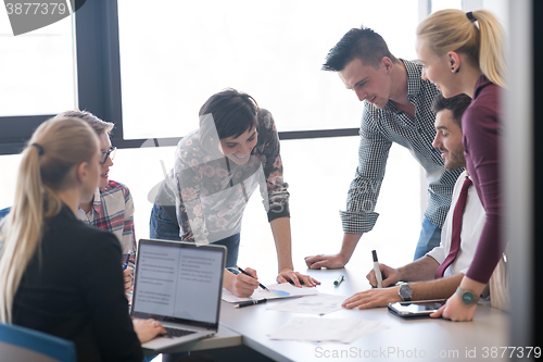 Image of young business people group on meeting at modern office