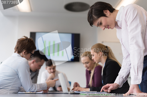 Image of young  woman using  tablet on business meeting