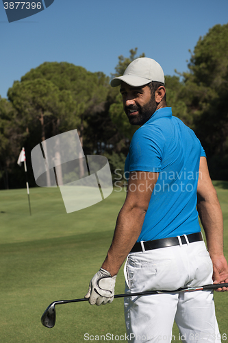 Image of golf player portrait from back