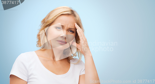 Image of unhappy woman suffering from headache