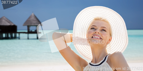 Image of beautiful woman enjoying summer over exotic beach