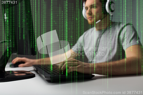 Image of close up of man playing computer video game